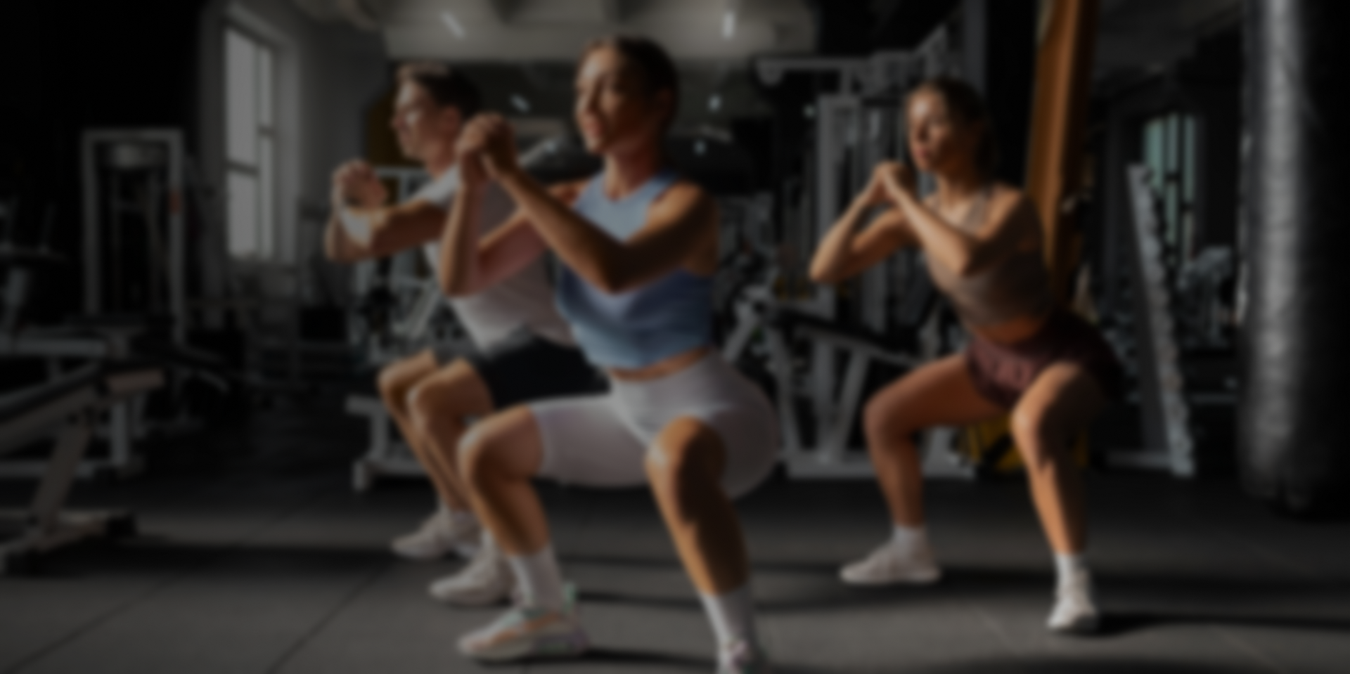 People doing planks in a fitness studio
